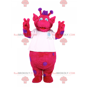 Mascota de personaje fucsia con manchas moradas. -