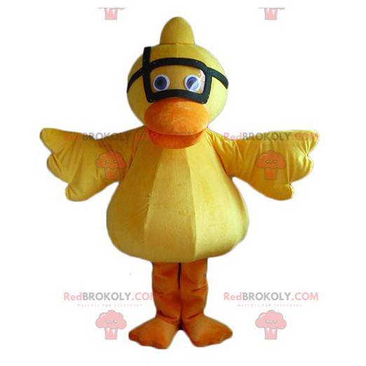 Gelbes und orange Entenkükenmaskottchen mit einer Maske -