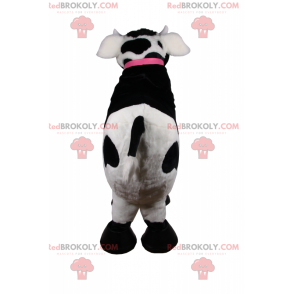 Mascotte de vache avec collier rose et clochette -