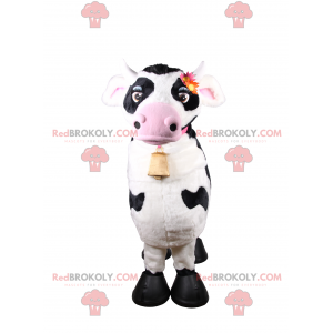 Mascotte de vache avec collier rose et clochette -