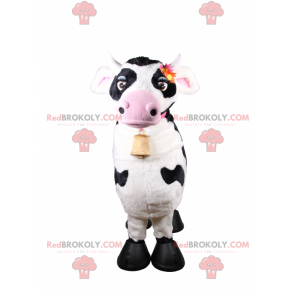 Mascotte de vache avec collier rose et clochette -