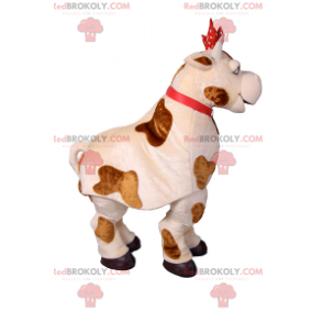 Ko maskot med röd rosett och klocka - Redbrokoly.com
