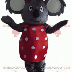 Gray koala mascot with a red dress with white polka dots -