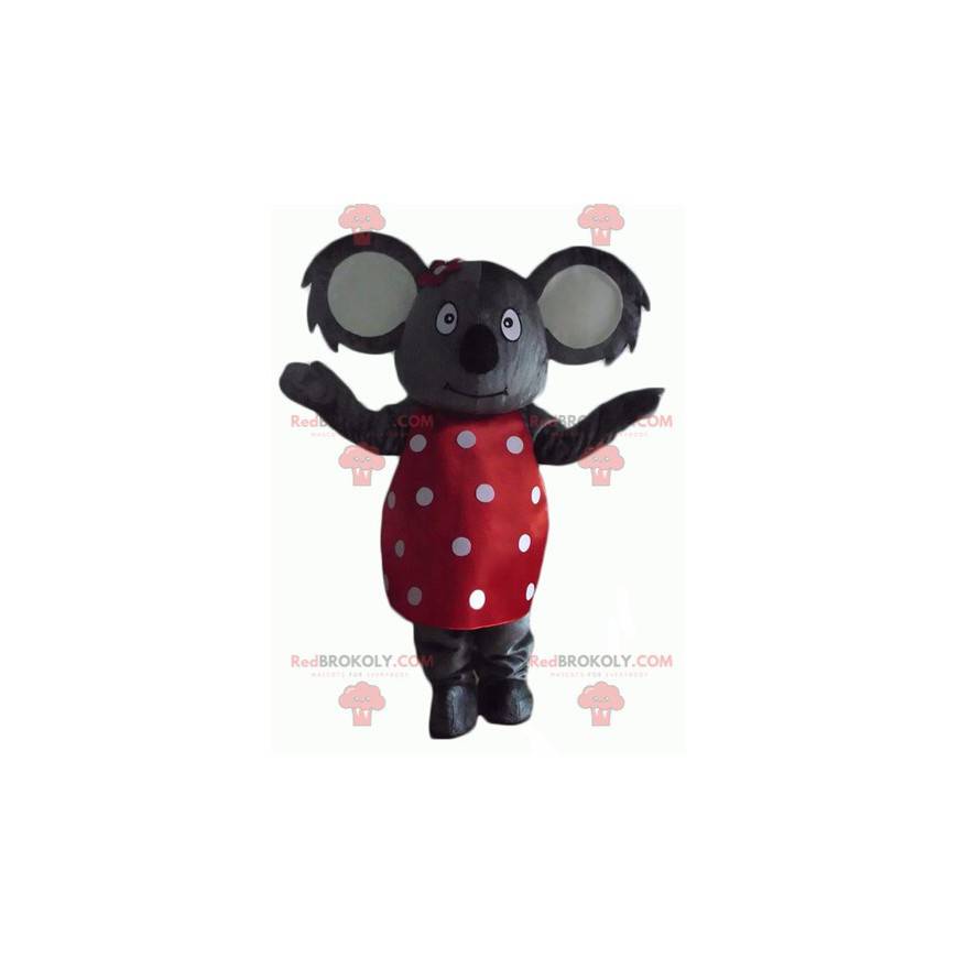 Mascotte koala grigio con un vestito rosso a pois bianchi -