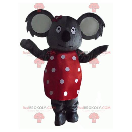 Gray koala mascot with a red dress with white polka dots -