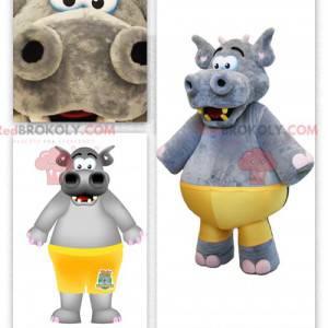 Mascotte de gros hippopotame gris avec un maillot jaune -