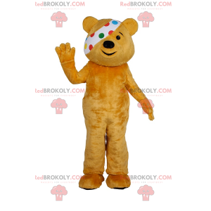 Teddy bear mascot duo with polka dot headband in the right eye