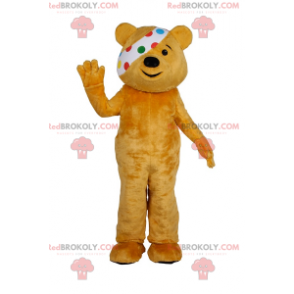 Teddy bear mascot duo with polka dot headband in the right eye