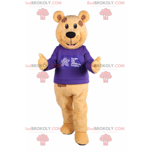 Bärenmaskottchen mit lila Pullover - Redbrokoly.com
