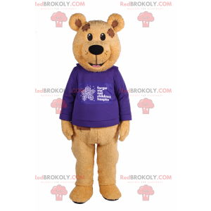 Bärenmaskottchen mit lila Pullover - Redbrokoly.com