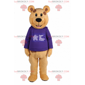 Bärenmaskottchen mit lila Pullover - Redbrokoly.com