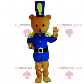 Mascota del oso de peluche en traje de soldado azul -