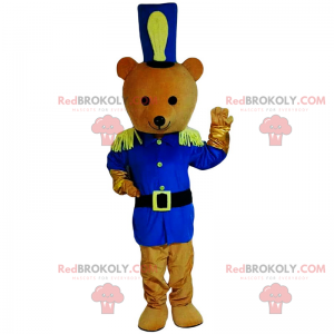 Mascote do ursinho de pelúcia com roupa de soldado azul -