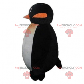 Pequeña mascota pingüino sonriendo - Redbrokoly.com