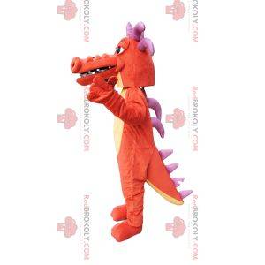Mascotte de dragon orange, avec des cornes violettes!