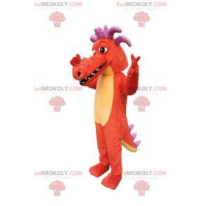 Mascotte de dragon orange, avec des cornes violettes!