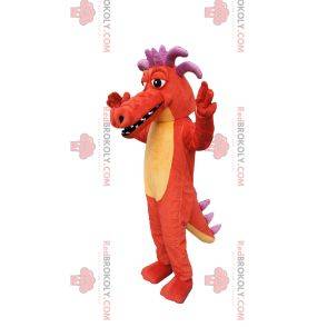 ¡Mascota dragón naranja, con cuernos morados!