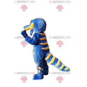 Mascote de dinossauro super feliz azul e amarelo