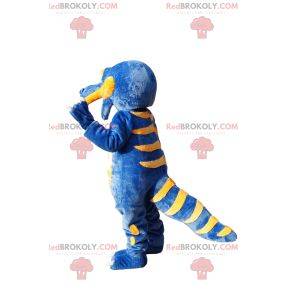 Mascota dinosaurio azul y amarillo súper feliz