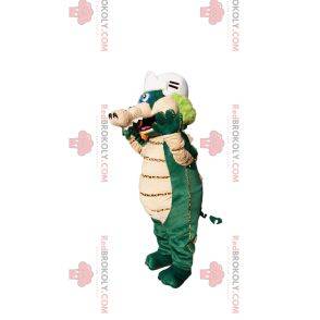 Grünes und beiges Dinosauriermaskottchen mit einem Baseballhelm