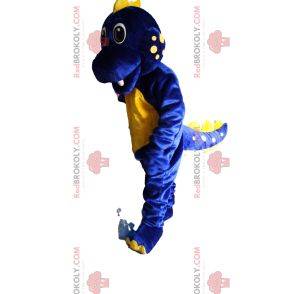 Mascota dinosaurio azul y amarillo súper emocionado