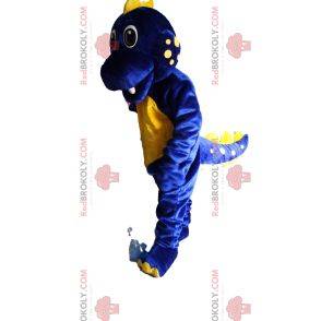 Super opgewonden blauwe en gele dinosaurusmascotte