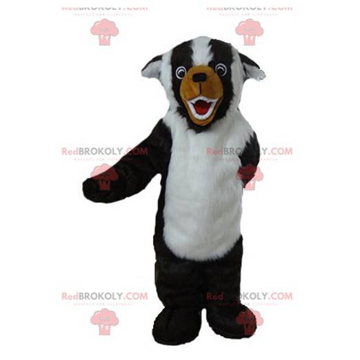 Mascotte de chien noir blanc et marron tout poilu -