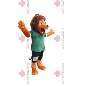 Orange lion mascot with green and black sportswear