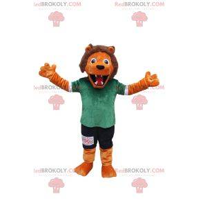 Mascote leão laranja com roupa esportiva verde e preta