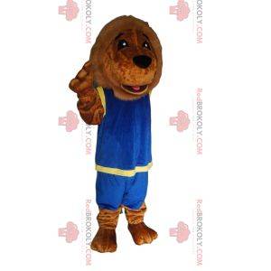 Mascota del león con un traje deportivo azul