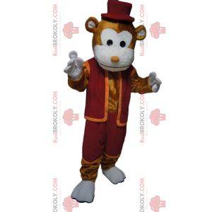 Mascotte de singe marron joyeux avec une tenue et un chapeau bordeaux