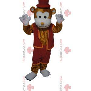 Munter maskot med brun ape med burgunder-antrekk og hatt