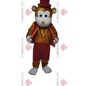 Cheerful brown monkey mascot with a burgundy outfit and hat