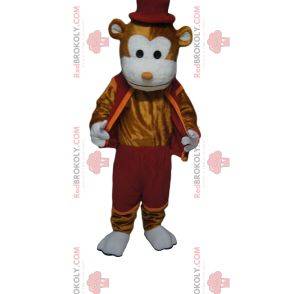 Mascotte de singe marron joyeux avec une tenue et un chapeau bordeaux