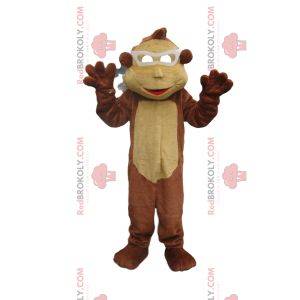 Mascotte de singe marron et beige avec des lunettes blanches