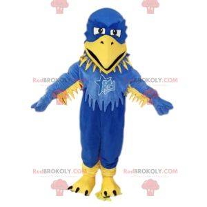 Mascotte d'aigle bleu et jaune, avec des volants. Costume d'aigle