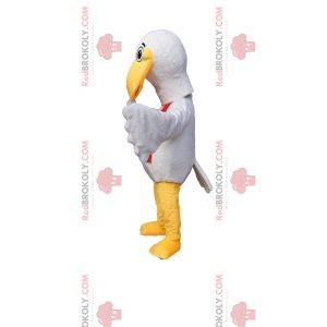 Mascotte uccello bianco con un divertente becco e una sciarpa rossa