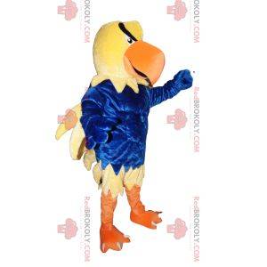 Mascotte d'aigle jaune avec un maillot bleu