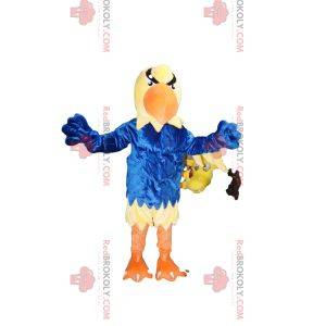 Mascotte d'aigle jaune avec un maillot bleu