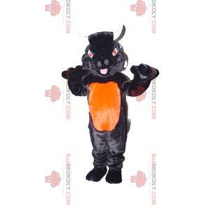 Mascotte de taureau noir et orange avec des yeux rouges