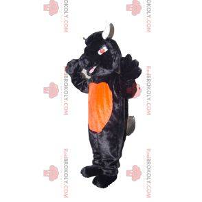 Mascota de toro negro y naranja con ojos rojos