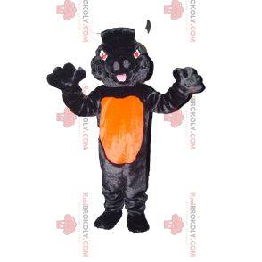 Mascotte toro nero e arancione con gli occhi rossi