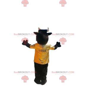 Mascote touro muito entusiasmado com camisa amarela