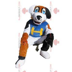 Tricolor dog mascot with a blue supporter jersey