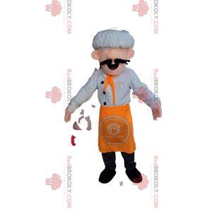 Mascota del chef con un sombrero blanco y un delantal naranja.