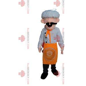 Mascotte del cuoco unico con un cappello bianco e un grembiule arancione.