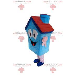 Blaues Hausmaskottchen mit einem kleinen Kamin