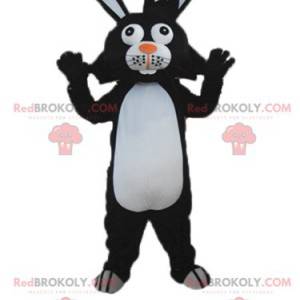 Mascotte de lapin noir et blanc aux grandes oreilles -