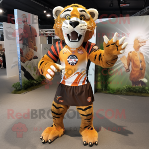 Rust Saber-Toothed Tiger mascot costume character dressed with a Rugby Shirt and Scarf clips