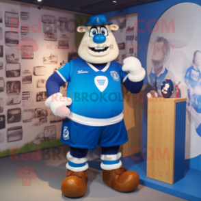 Blue Pendant mascot costume character dressed with a Rugby Shirt and Belts
